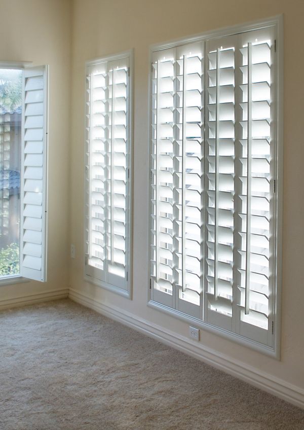 White shutters  accentuate light living room in Scottsdale AZ and Boerne TX